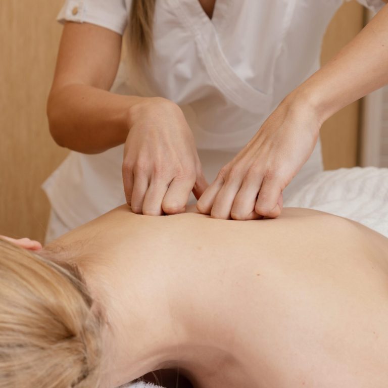 close-up-hands-massaging-back